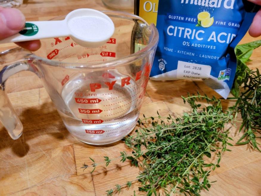 Herb acidification with citric acid for herb infused oils