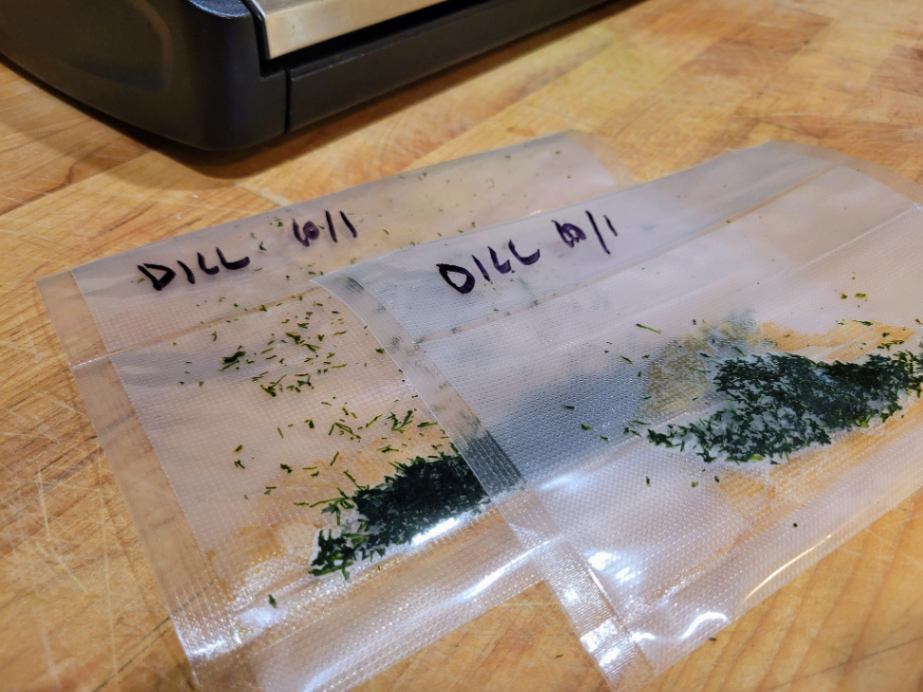 Labelled and dated vacuum sealed bags of chopped dill
